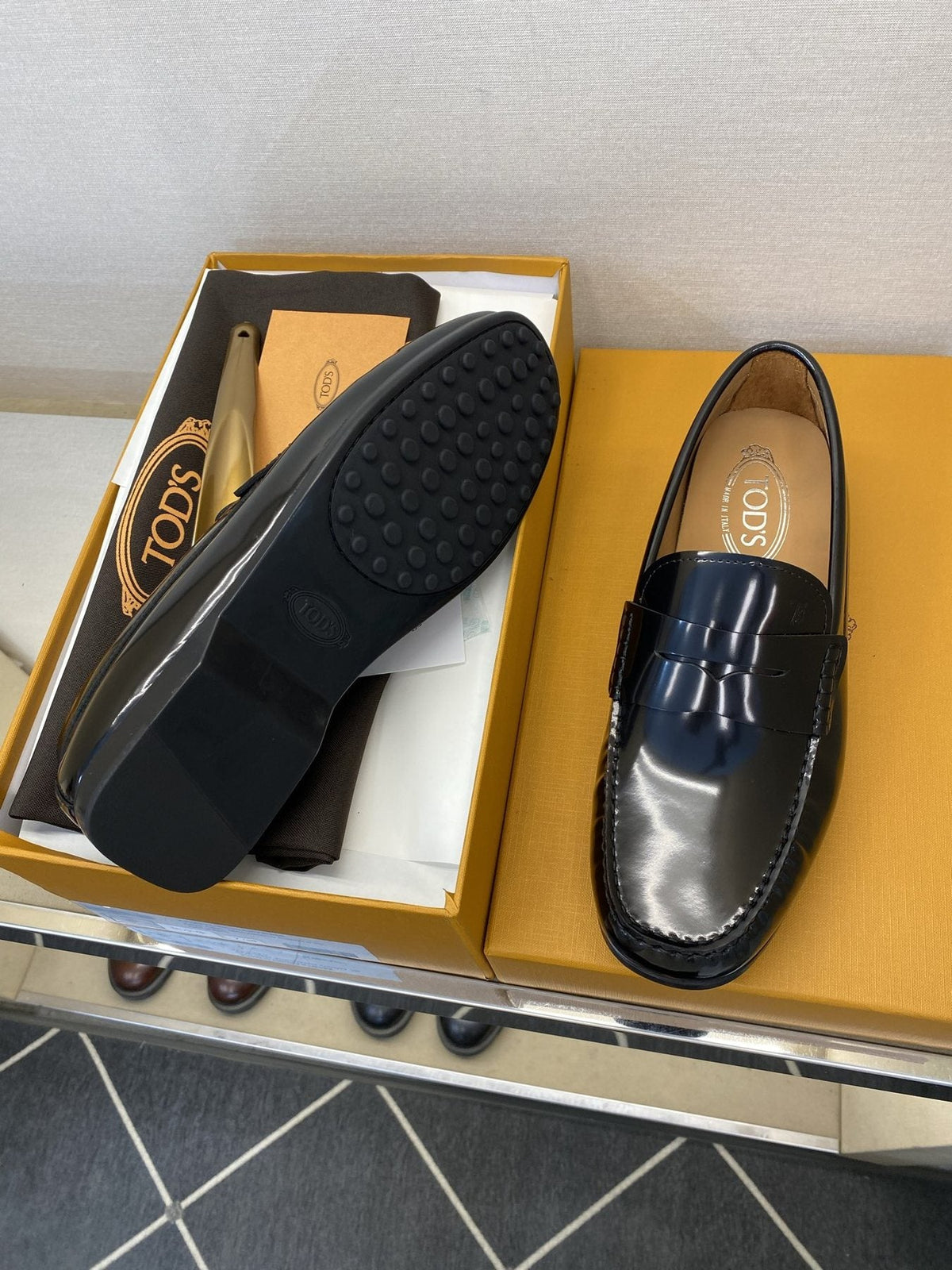 Tod's Glossy Dark Navy Penny Loafers — side