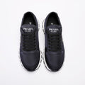 PRADA Navy Triangle Badge Sneakers — hero